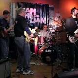 (l. to r.) Aaron Leonard, Bass	 Tom Krebs, guitar Sam Hopper, drums Ryan Vee, guitar and vocals