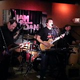 Dan Button (center) – Lead Vocals, Guitar, Harmonica and Keyboards