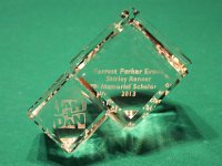 ...one engraved crystal for the Renner family, and one for Forrest...